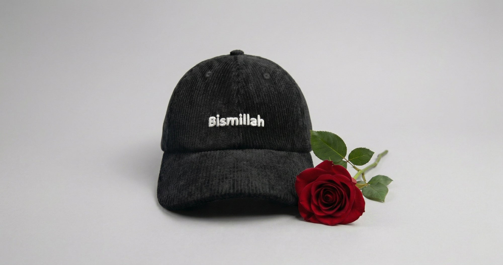 Premium Bismillah Embroidery Corduroy Cap with Vibrant Red Rose laying next to it | Ramoking
